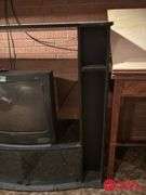 Entertainment Center and TV Measures 54 by 20 by 49.  TV 25 In