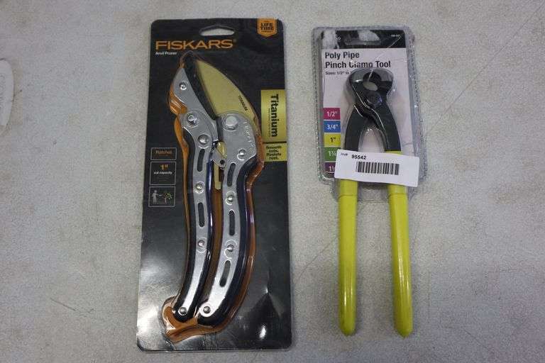 Poly pipe pinch clamp tool and Fiskars anvil pruner Matthews Auctioneers