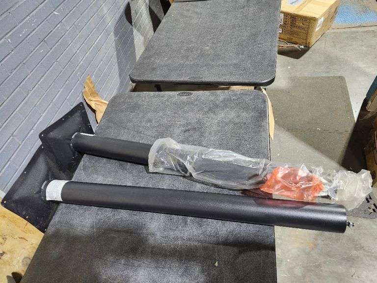 2 restaurant table support poles - Matthews Auctioneers
