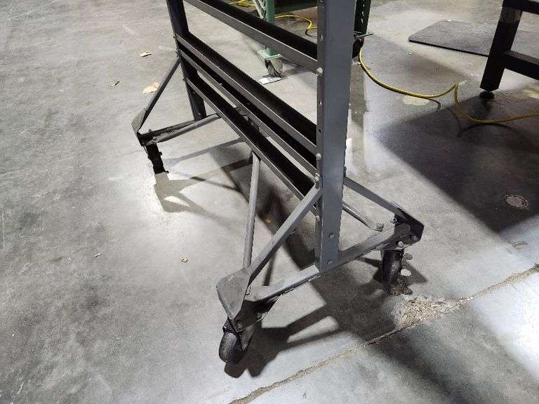 Textile fabric display rack with wheels