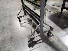 Textile fabric display rack with wheels