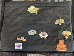 Group of 30+ Disney Enamel Pins and Pin Collector Case