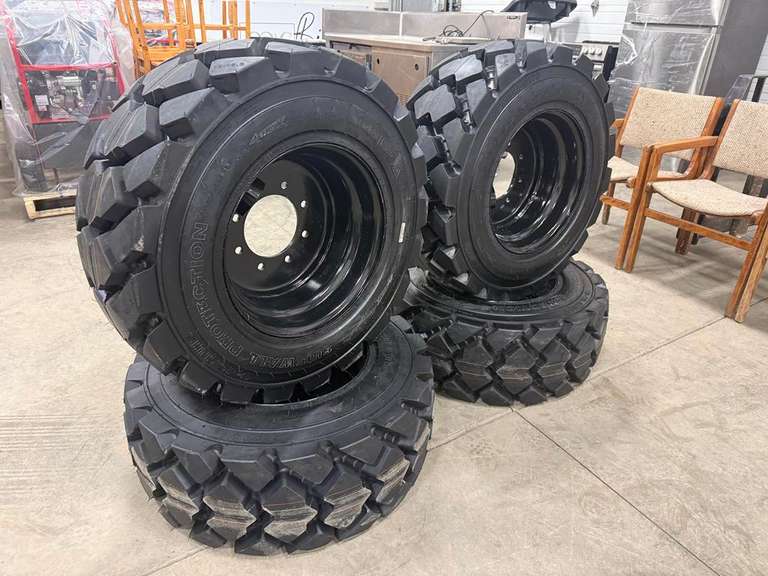 Unused 14 Ply 12-16.5 Skid Steer Tire on Steel Rim - Must Take 4 Times the Bid Price