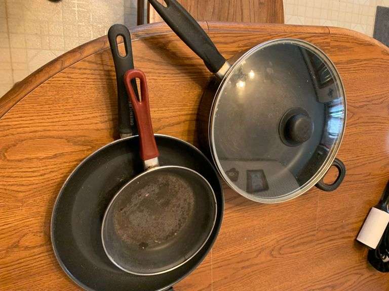 Contants of cabinet: Skillets and cookware
