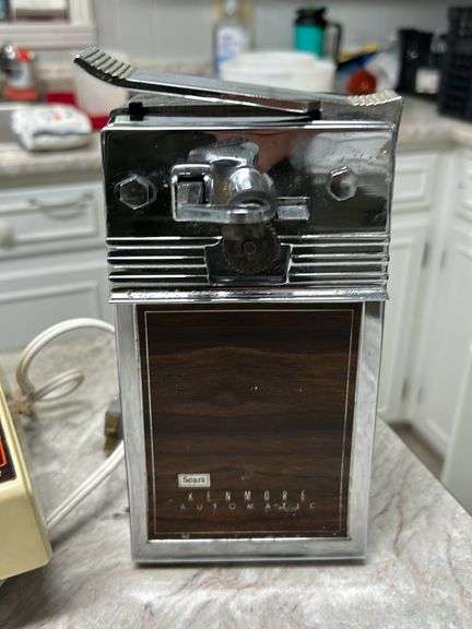 Contebts of cabinet and drawer- Baking pans -skillets -Blender- can opener and more