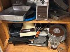 Contebts of cabinet and drawer- Baking pans -skillets -Blender- can opener and more