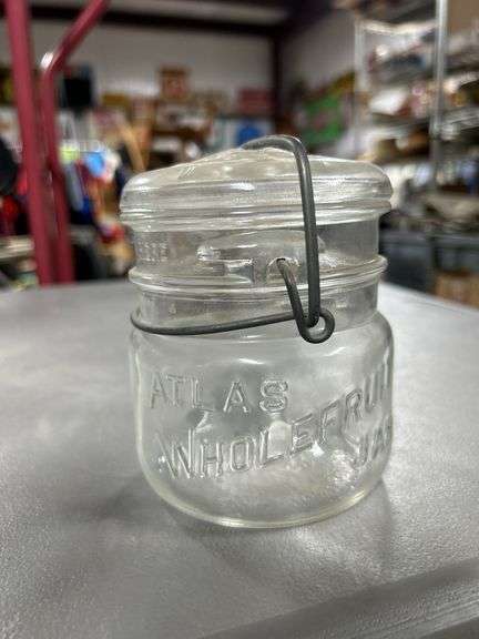 Nice old glass top Atlas While fruit jar