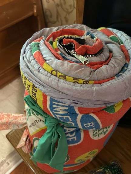 Vintage sleeping bag and Marti gra items