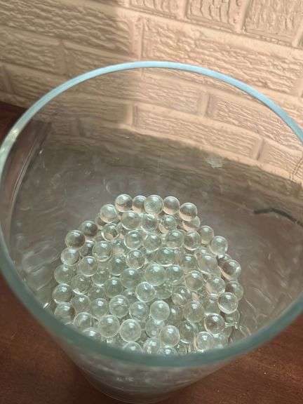 Large glass vase with lots of Marbles