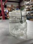 Nice old glass top Atlas While fruit jar