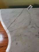 Harp base marble top table has a crack