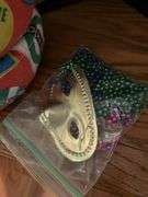 Vintage sleeping bag and Marti gra items