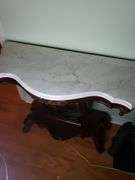 Harp base marble top table has a crack