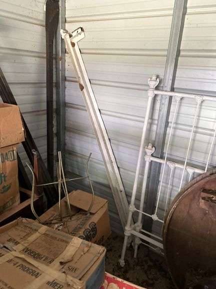 Tubs of misc and boxes of misc -pedestal table -wrought iron bed with rails -lamps-rugs