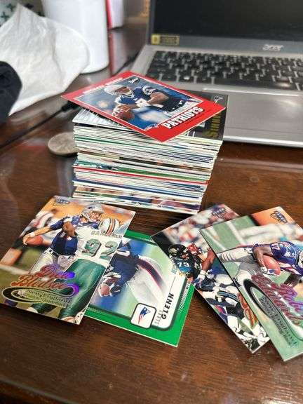 Large stack of assorted New England Patriots football