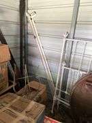 Tubs of misc and boxes of misc -pedestal table -wrought iron bed with rails -lamps-rugs