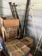 Tubs of misc and boxes of misc -pedestal table -wrought iron bed with rails -lamps-rugs