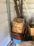 Tubs of misc and boxes of misc -pedestal table -wrought iron bed with rails -lamps-rugs