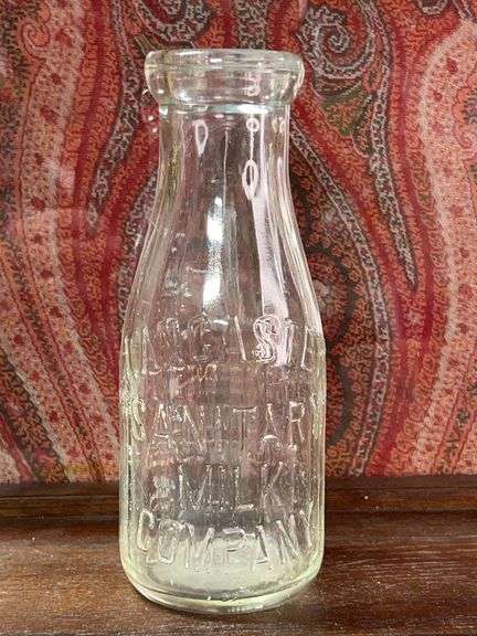 Old pint embossed Milk bottle