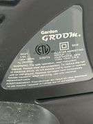 Garden Groom Pro electric head trimmer with plastic trimming bagger attached -works
