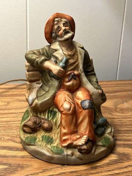 VINTAGE OLD MAN ON BENCH WITH LIQUOR BOTTLE