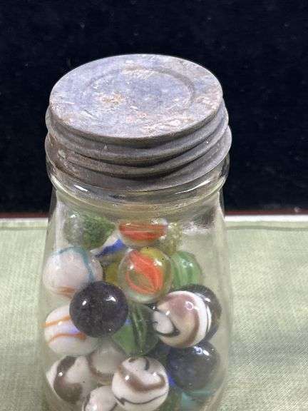 Nice old jar with big Thumper marbles