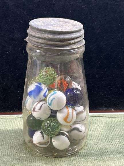 Nice old jar with big Thumper marbles