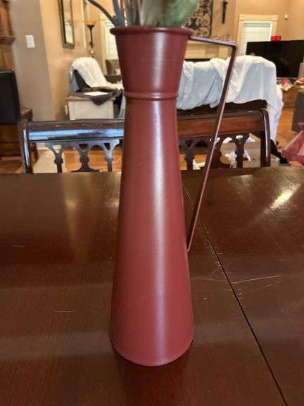 Metal vase with arrangement