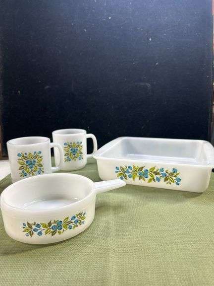 Jeannette Glasbake set in the "Huckleberry" pattern, featuring a square baking dish, a small saucepa