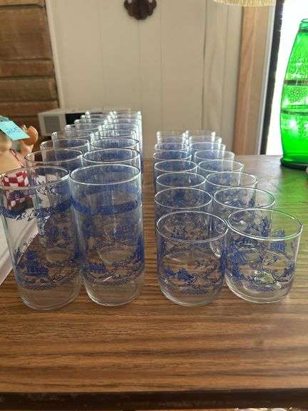 Set of 16 drinking glasses with 16 matching juice glasses.