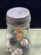 Nice old jar with big Thumper marbles