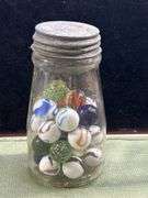 Nice old jar with big Thumper marbles