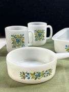 Jeannette Glasbake set in the "Huckleberry" pattern, featuring a square baking dish, a small saucepa
