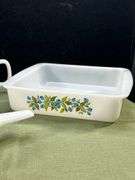 Jeannette Glasbake set in the "Huckleberry" pattern, featuring a square baking dish, a small saucepa