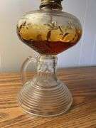 Early finger lamp with embossed designs