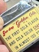 Super find! Golden Cola SUNDROP Lighter in original box