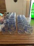 Set of 16 drinking glasses with 16 matching juice glasses.