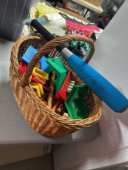 Nice basket of lincoln logs and a toy bat ￼