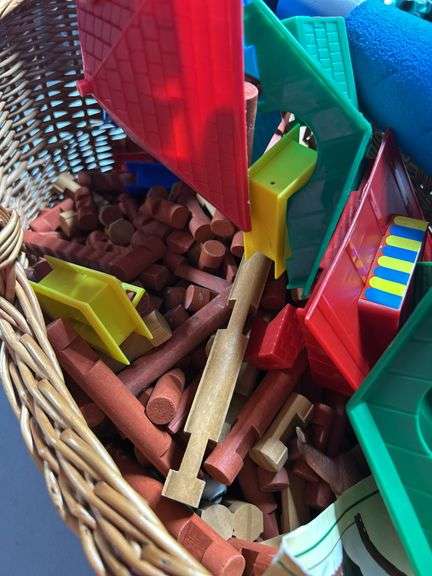 Nice basket of lincoln logs and a toy bat ￼
