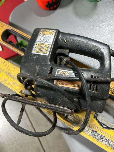 Pair of levels and skil jigsaw