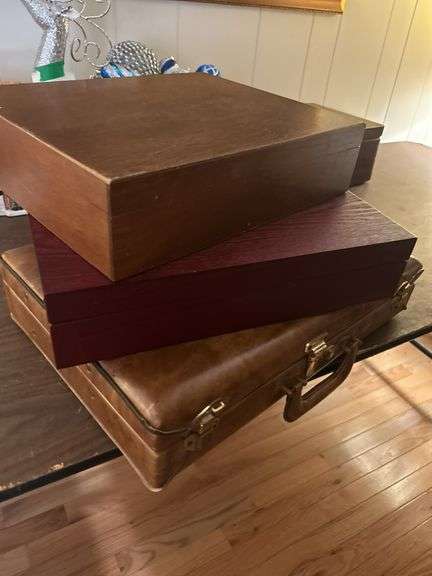Two silverware boxes and a vintage briefcase