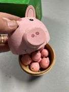 Wooden piggy banks and mini pigs