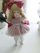 Porcelain doll w/stand