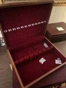 Two silverware boxes and a vintage briefcase