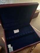 Two silverware boxes and a vintage briefcase