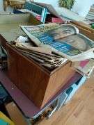 Metal box full of old newspapers