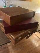 Two silverware boxes and a vintage briefcase