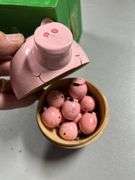 Wooden piggy banks and mini pigs