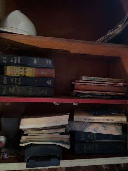 Shop manuals and misc in cabinet