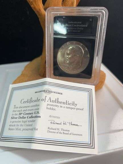 1976 authenticated brilliant uncirculated Eisenhower dollar ￼